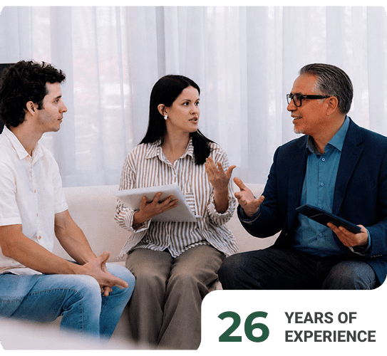 Three people in a consultation meeting